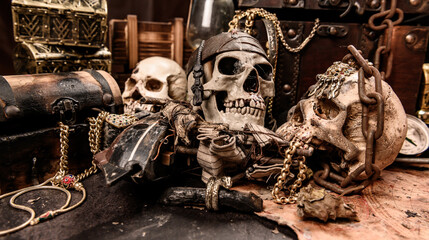 Obraz na płótnie Canvas Pirate with human skull. Treasure chest and gold. Discovery equipment and explorer for disappear fortune.