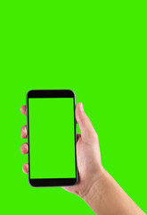 man's hand holding a mobile telephone with a vertical green screen in tram chroma key smartphone technology cell phone touch message display hand