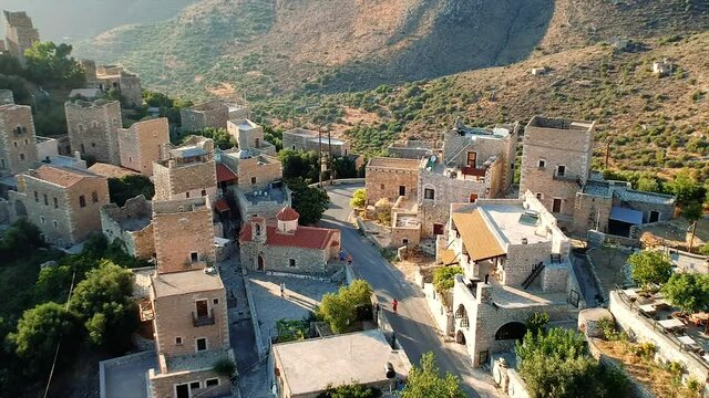 Amazing view over Vathia village against a dramatic sunset sky. Vathia, Mani, Laconia, Peloponnese, Greece