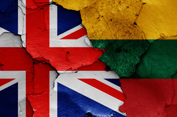 flags of UK and Lithuania painted on cracked wall
