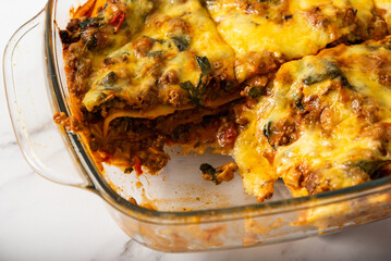 Beef lasagna with spinach and mozzarella cheese 