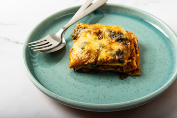 Beef lasagna with spinach and mozzarella cheese 