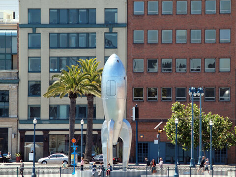 0-foot Raygun Gothic Rocketship sculpture that adorns the San Francisco waterfront at the city's Pier 14 with people hanging out
