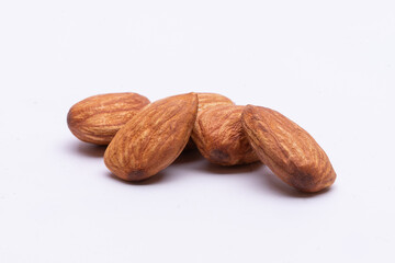 almonds on white background,Background of big raw peeled almonds situated arbitrarily