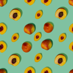 Peaches seamless pattern on a green background. Fruit pattern.