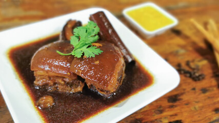 Selective focus of Moo Hong(Stewed pork belly), stewed pork with brown sauce or sweet gravy soy sauce, local food in Phuket Southern Thailand style. 