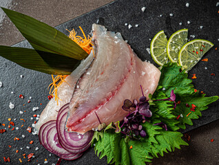 Delicious fresh fish on dark  background