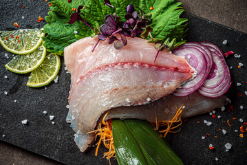 Delicious fresh fish on dark  background