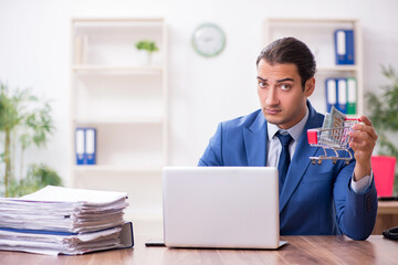 Young male businessman in ecommerce concept