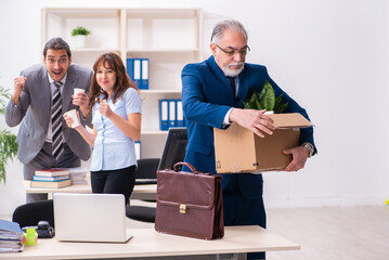 Two male and one female employees working in the office