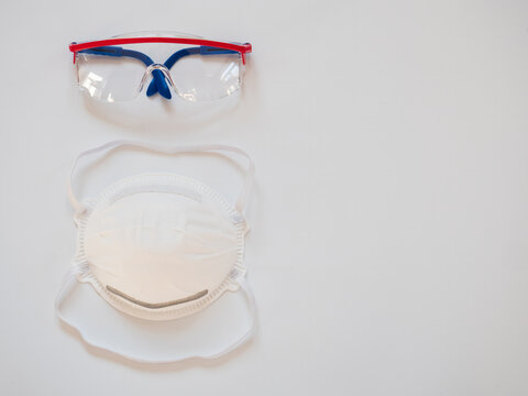 white protective medical mask with clipping path on white background, Pair of safety goggles