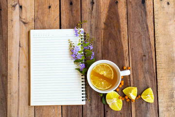 herbal healthy drinks hot honey lemon health care for cough sore with notebook and flower of...