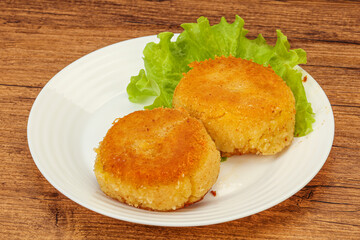 Vegan cuisine - Potato cutlet in the plate