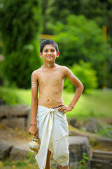 A indian priest child with holy water pot