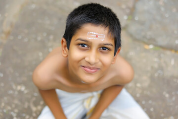 the portrait of indian priest child