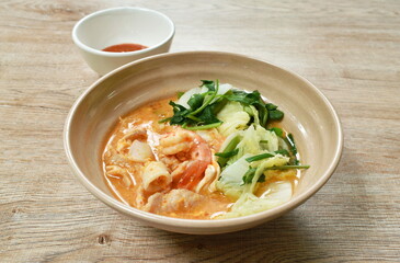 boiled seafood sukiyaki in soup with sauce