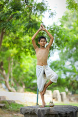 Fototapeta premium the indian priest child doing meditation