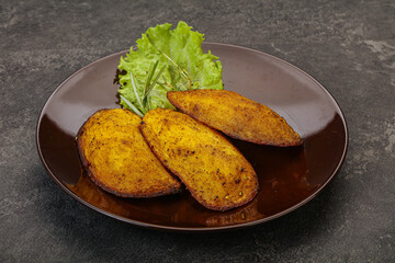 Baked potato with herbs and spices