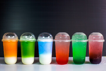 A close-up view of the drinks put into the cup, (iced tea, cocoa, chocolate) with pearls, is a popular menu in cafes and restaurants.