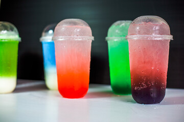 A close-up view of the drinks put into the cup, (iced tea, cocoa, chocolate) with pearls, is a popular menu in cafes and restaurants.