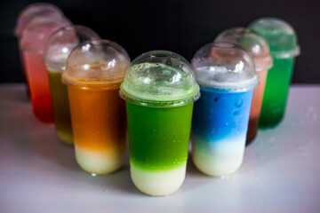 A close-up view of the drinks put into the cup, (iced tea, cocoa, chocolate) with pearls, is a popular menu in cafes and restaurants.