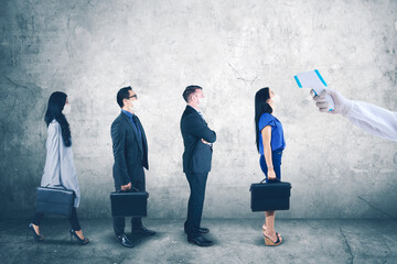 Business people check temperature before working