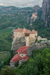Monasteries on the rocks of Meteora at sunrise in Greece.