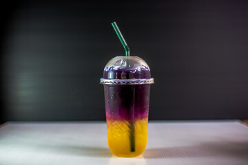 A close-up view of the drinks put into the cup, (iced tea, cocoa, chocolate) with pearls, is a popular menu in cafes and restaurants.
