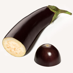 Ripe eggplant with cut pieces isolated on white background. Full depth of field. With clipping path.