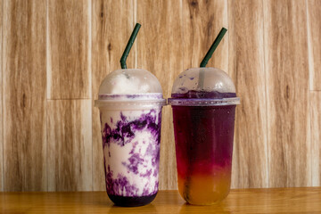 A close-up view of the drinks put into the cup, (iced tea, cocoa, chocolate) with pearls, is a popular menu in cafes and restaurants.