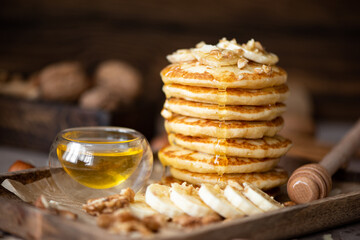 small pancakes with banana, walnuts and honey