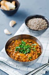 Cabbage Lentil stew in a bowl with parsley
