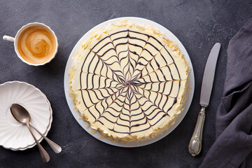 Traditional Hungarian Esterhazy cake, torte with cup of coffee. Grey background. Top view.