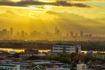 Blurred abstract background view of the night sky, ambience surrounded by condominiums and street lighting, dispersion of accommodation in the capital.