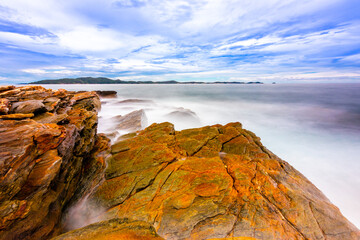 The sea spray hitting the rocks in the afternoon at Khao Laemya National Park Thailand.