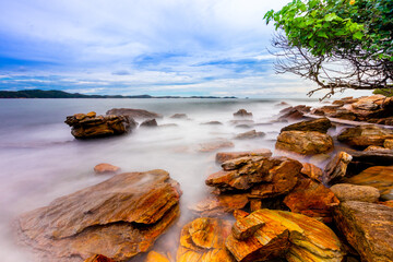 The sea spray hitting the rocks in the afternoon at Khao Laemya National Park Thailand.