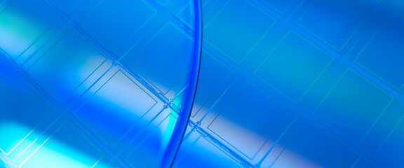 Macro of blue silicon wafer with microchips.Banner format.