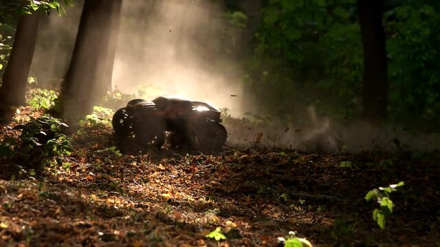 Remote control car in the forest. Off-road toy rc car in a forest.