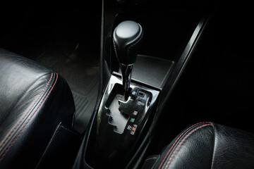 automatic transmission shift selector in the car interior. Closeup a manual shift of modern car gear shifter.