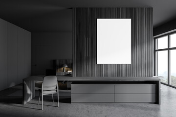 Dark wooden home office with poster