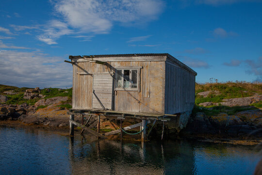 old gear shed for fishing equipment in a worthwhile harbor that was once a busy center for seasonal fishing. Now a dilapidated memory