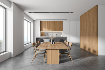 White and wooden kitchen with table