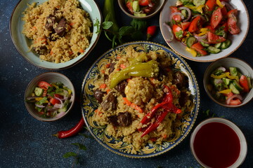 Uzbek cuisine (food) pilaf (plov palov osh) salad achichuk (achuchuk).Mutton,rice,carrots,vegetable oil,raisins,onion,turmeric,black pepper,cumin