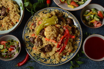 Uzbek cuisine (food) pilaf (plov palov osh) salad achichuk (achuchuk).Mutton,rice,carrots,vegetable oil,raisins,onion,turmeric,black pepper,cumin