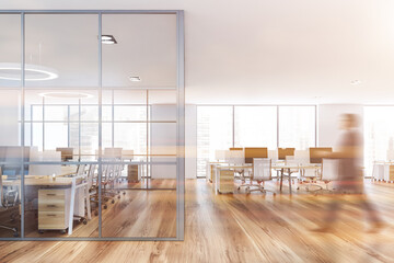 Man walking in white open space office