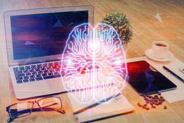Double exposure of desktop with computer and brain drawing hologram. Artificial intelligence concept.
