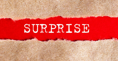 SURPRISE text appearing behind on torn paper.