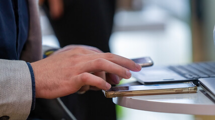 Trader Using Smartphone At Trade Fair 