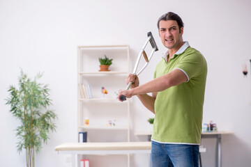 Young man waiting for doctor in the clinic