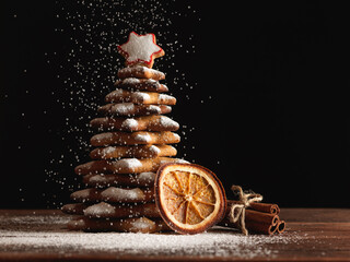 Christmas gingerbread cookies and spices on wooden background. Close-up - obrazy, fototapety, plakaty